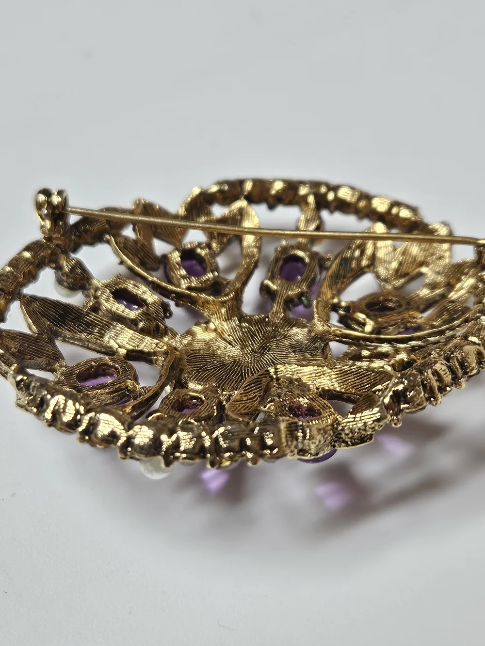 Gold-Tone Brooch with Purple Cabochons and Pearl Halo